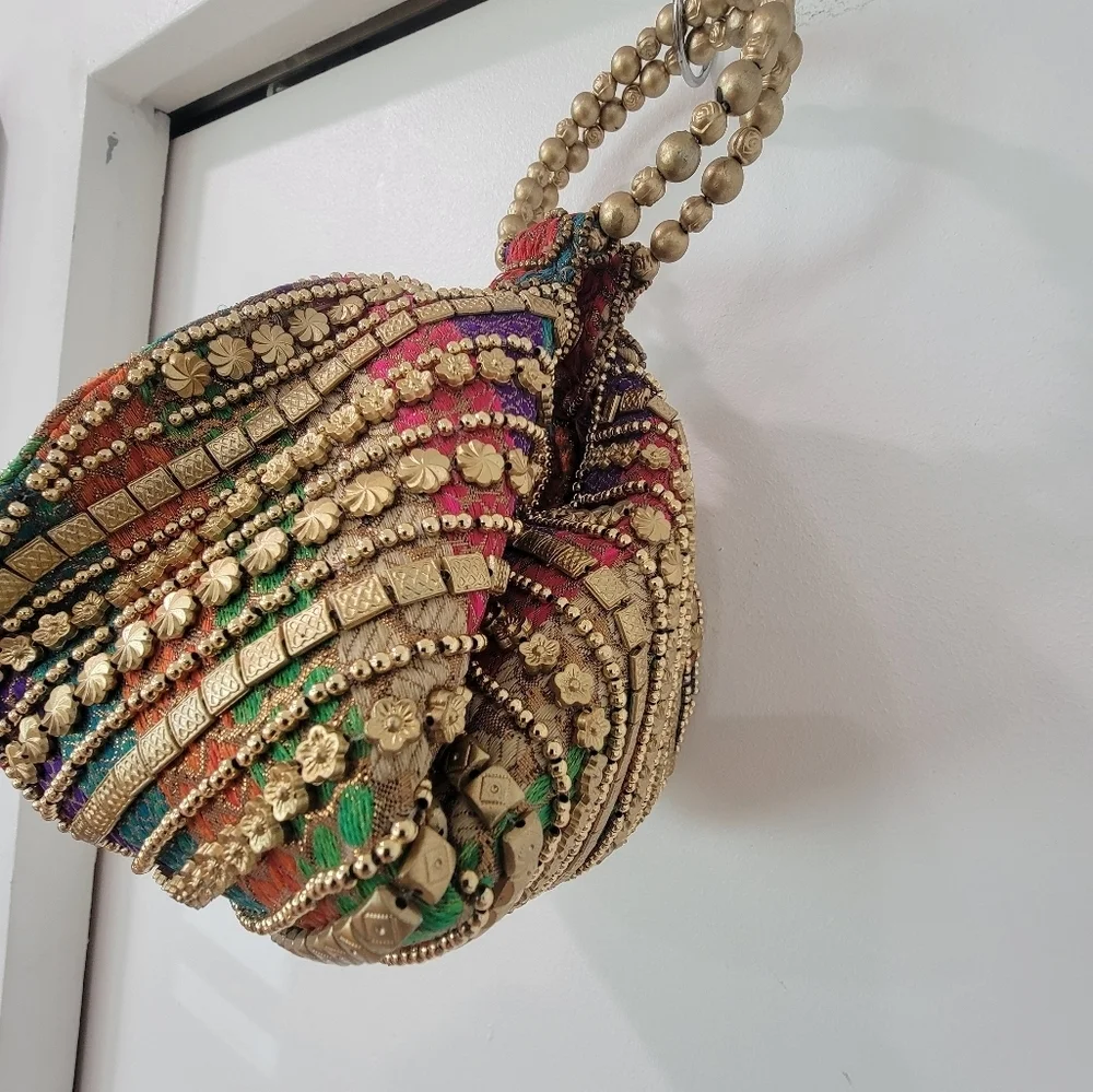 Multi-Colored Fortune Cookie Handbag With Gold Embellishments